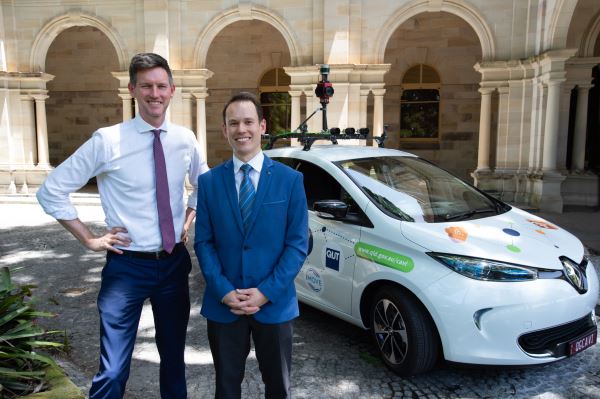 Minister Mark Bailey and Prof Michael Milford with the AI car